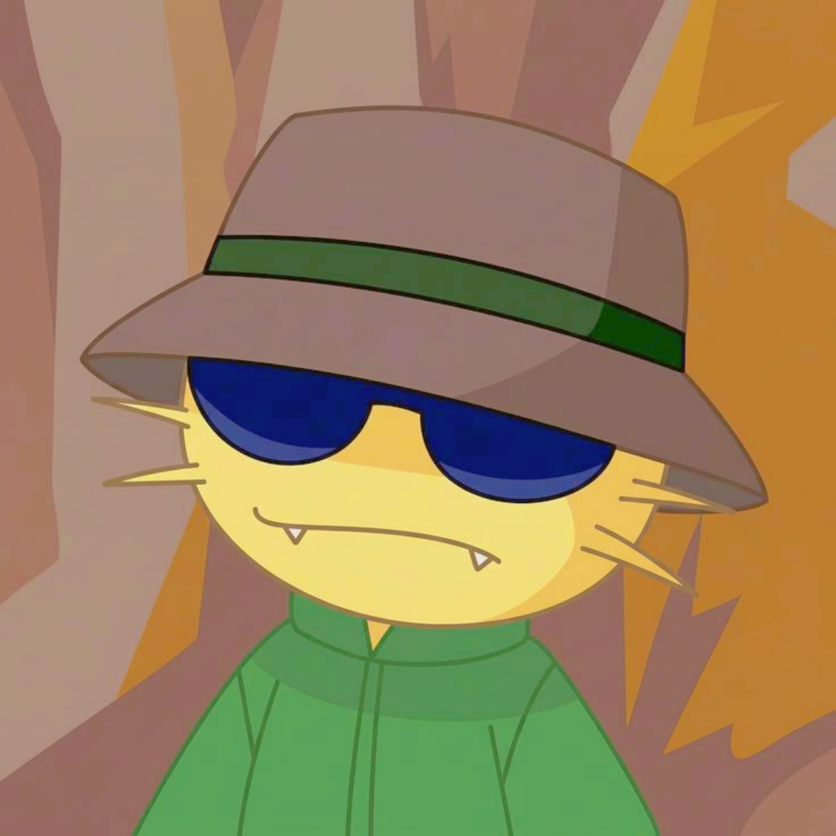 Yellow cat in a hat and sunglasses